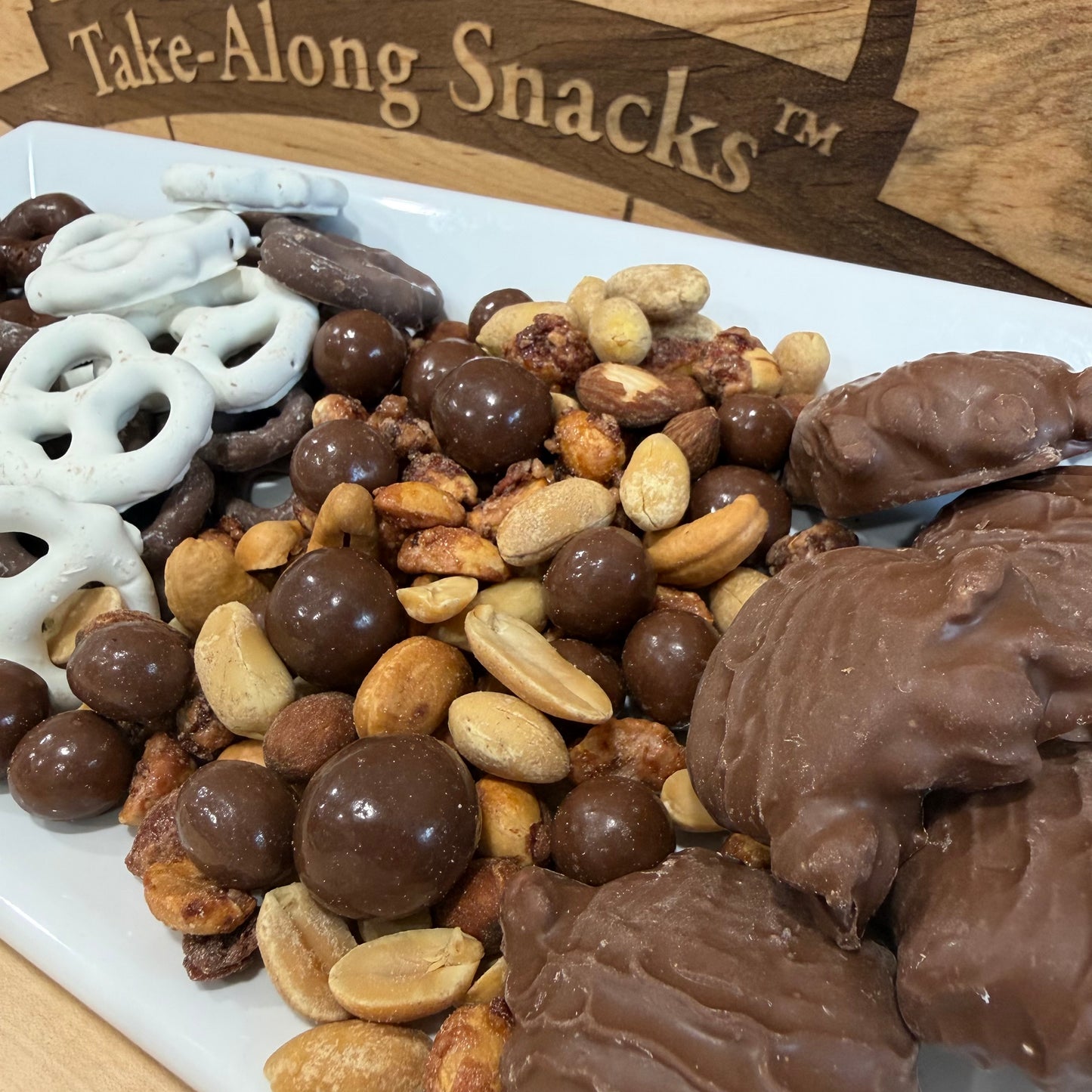 Comforting snacks including yogurt pretzels, nut mixes, and chocolate treats.